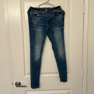 American Eagle light wash skinny jeans.
